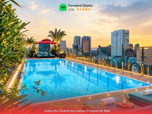 a large swimming pool on the roof of a building at Happy Life Grand Hotel & Rooftop Skybar in Ho Chi Minh City