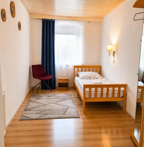 a bedroom with a bed and a window at Naab-burg in Nabburg