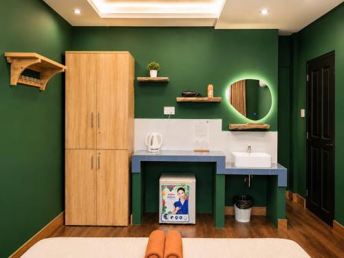 a bathroom with a sink and a mirror at Ben Thanh Hideaway - A Cozi Stay in Ho Chi Minh City