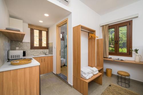 a kitchen with a sink and a counter top at Galma Luxury Homes in Kalymnos