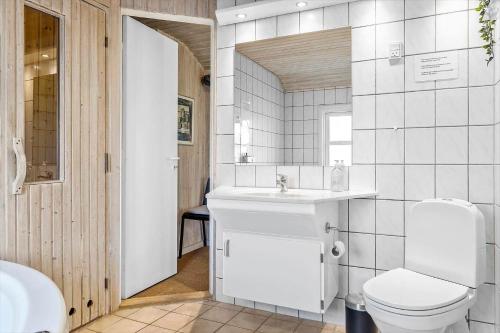 a bathroom with a toilet and a sink at 1319-Thisted-Store-Knuds-Vej-9 in Thisted