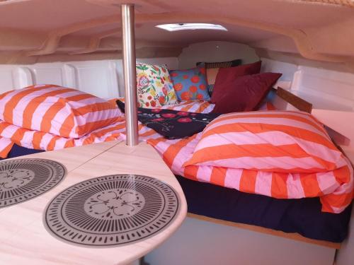 a group of beds in the back of a van at Bateau Gîte in Berné