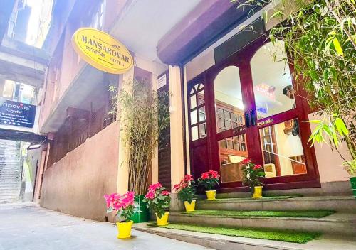 a building with a sign on the front of it at Rare Himalayas Mansarovar in Darjeeling