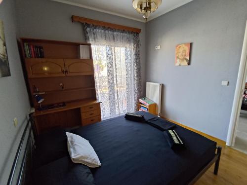a bedroom with a bed and a window at Dream Home in Sparta