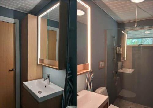 a bathroom with a sink and a toilet and a mirror at OH293-Hadsund-Jaegerskoven-15 in Hadsund