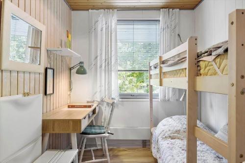 a bedroom with a desk and bunk beds at OH293-Hadsund-Jaegerskoven-15 in Hadsund