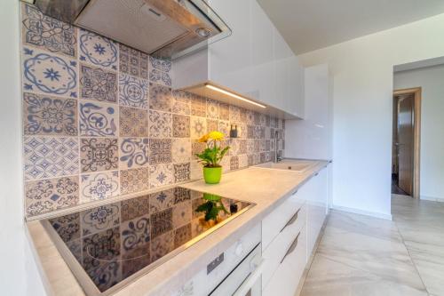 a kitchen with a counter with a fish tank at Bella Casa in Sukošan