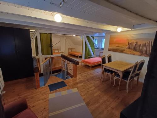 a living room with a table and a dining room at Apartment Mammut Loft in Balve