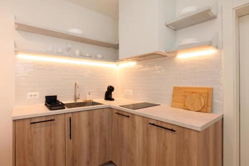 a kitchen with a sink and a counter top at Casa Serena Bol in Bol