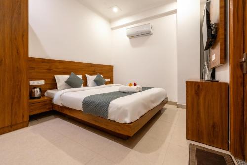 a bedroom with a large bed in a room at The Namami Tapovan in Rishīkesh