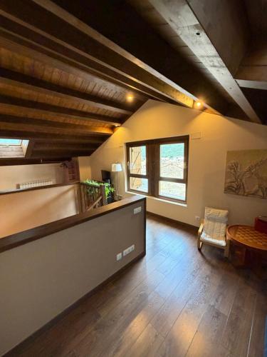 a living room with a counter and a window at Casa Robelca in Biescas