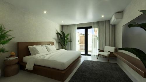 a bedroom with a bed and a chair in it at LIB LIB Lio in El Nido