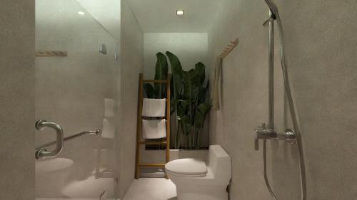 a bathroom with a shower and a toilet and a plant at LIB LIB Lio in El Nido