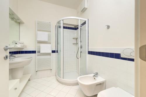 a bathroom with a shower and a toilet and a sink at The Lake Balcony by Gardenjoy in Brenzone sul Garda