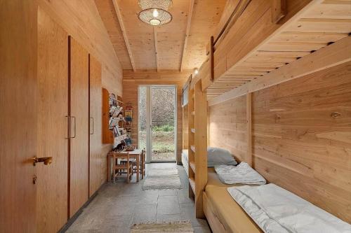 a small room with two beds and a window at 2314-Stege-Ulvshale-Cedervej-4-B in Tyrholm