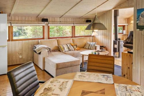 a living room with a couch and a table at 8256-Vordingborg-Kastaniegardsvej-4 in Vordingborg