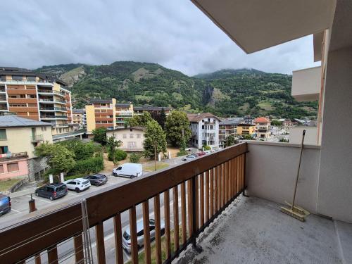 a balcony with a view of a city at Studio centre Bourg-Saint-Maurice in Bourg-Saint-Maurice
