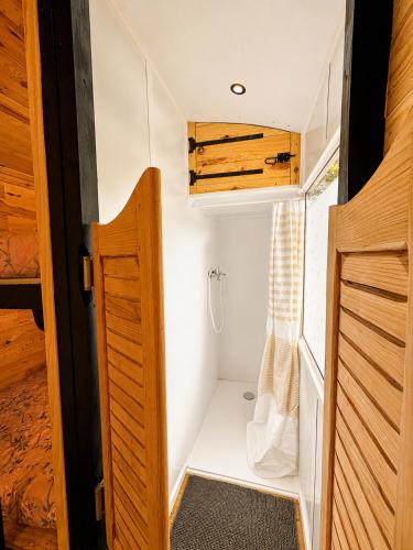 a small closet in a tiny house at Roulotte Cowboy - Tiny House insolite in Mignaloux-Beauvoir