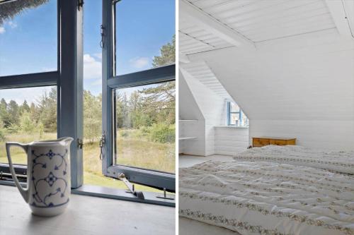 a bedroom with a bed and a window at 0213-Romo-A-Hveyselsvej-3 in Høm