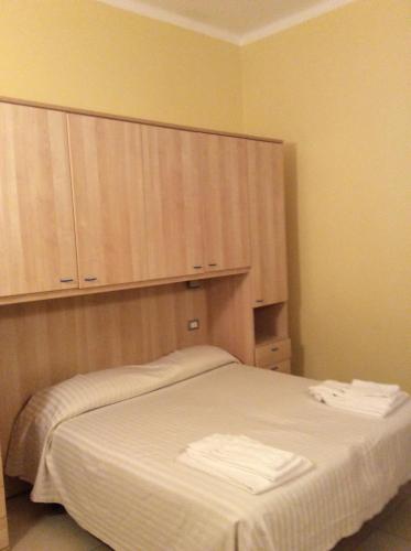 Ein Bett oder Betten in einem Zimmer der Unterkunft Residence Conchiglia Aparthotel