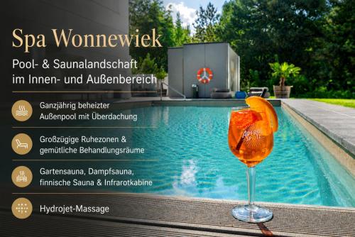 a magazine advertisement for a spawomenshock with a drink next to a pool at Parkhotel Rügen in Bergen auf Rügen