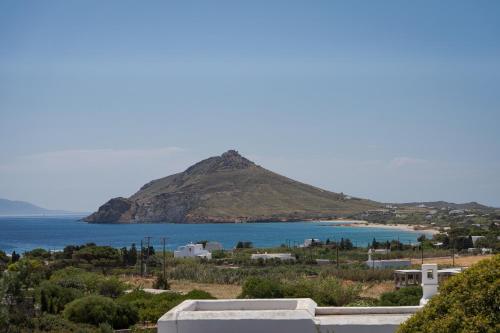a view of a mountain and a body of water at Villa Kohyli by Mediterà in Isterni