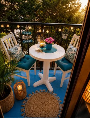 a white table and two chairs on a balcony at Santiago Apartment Mallorca in Cala Figuera