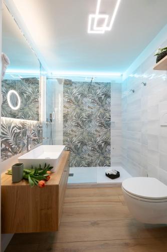 a bathroom with a sink and a toilet and a shower at Sharon House in Amalfi