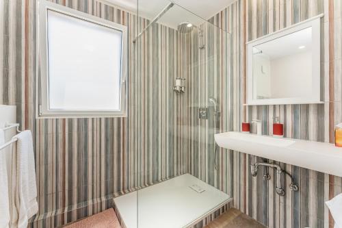 a bathroom with a sink and a mirror at Casa S’Arraval in Mahón