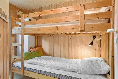 a bedroom with two bunk beds in a cabin at LF14218-Roslev-Skovsovej-4 in Roslev