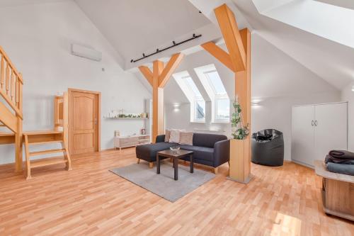 a living room with a couch and a table at Apartmány Nerudova in Vítkovice
