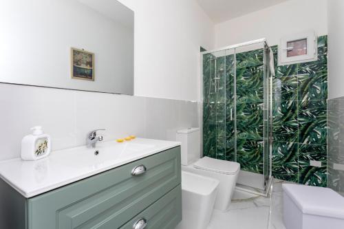 a bathroom with a sink and a shower at Etnamia Art in Paterno