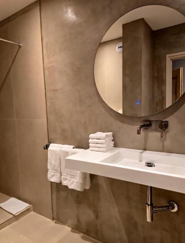 a bathroom with a sink and a mirror at Castellu Rossu in Lucciana