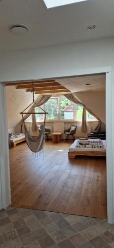 a room with a hammock hanging from the ceiling at Pod Vinicí in Mikulov