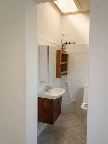 a bathroom with a sink and a toilet at Kilifi Hideaway,Spacious Coastal Retreat in Kilifi