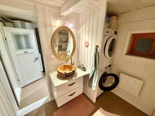 a bathroom with a sink and a mirror at LF11124-Struer-Vesterkaervej-24 in Struer