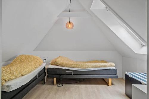 a room with two beds in a attic at LF11124-Struer-Vesterkaervej-24 in Struer