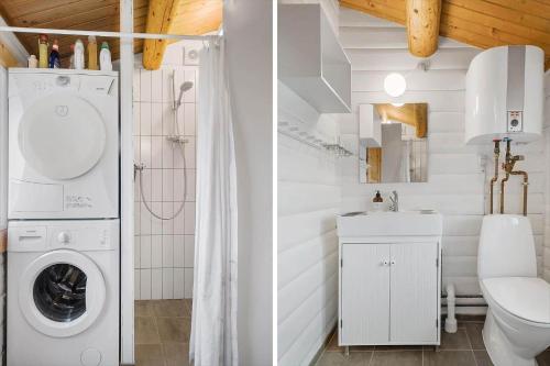 a white bathroom with a washing machine in it at LF544-Hurup-Thy-Skraningen-3 in Doverodde