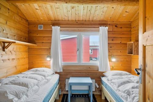 a bedroom with two beds and a window at LF544-Hurup-Thy-Skraningen-3 in Doverodde