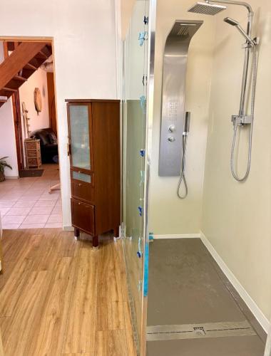 a shower with a glass door in a bathroom at Domaine d'Equital'Or in Cressanges