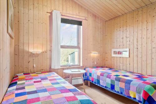 a bedroom with two beds and a window at LF241-Snedsted-Kongens-Borer-10 in Snedsted