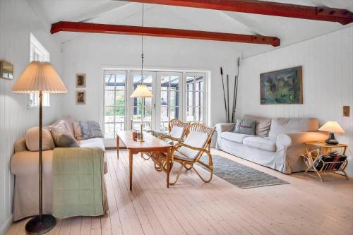 a living room with a couch and a table at 10040-Rorvig-Lyngvaenget-10 in Rørvig