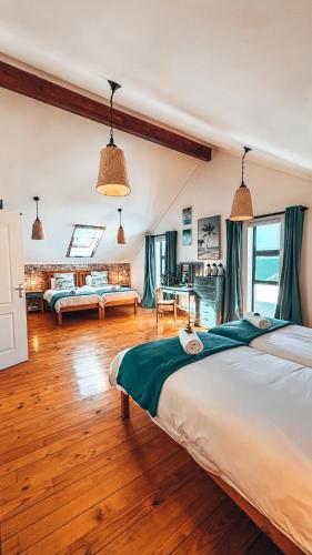 a bedroom with a large bed in a room at Buff and Fellow by the Bay in Great Brak River