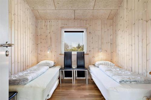 a room with three beds and a window at LF626-Snedsted-Kongens-Borer-4 in Snedsted