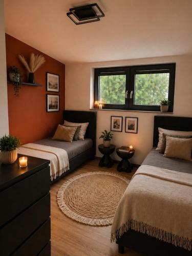 a bedroom with two beds and a window at Dream House 8 osób - cały dla Ciebie in Gdów