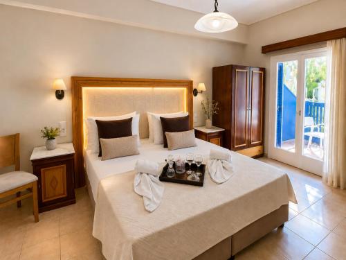 Vuode tai vuoteita majoituspaikassa Karidis Hotel