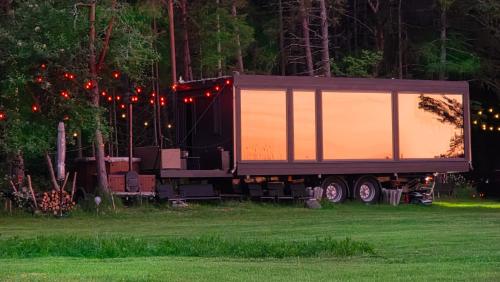 a large semi truck parked in a field at LuigeLaguun in Triigi