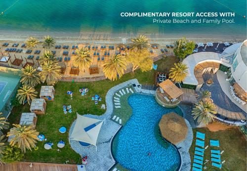 an aerial view of a resort with a swimming pool at Le Meridien Abu Dhabi Resort in Abu Dhabi