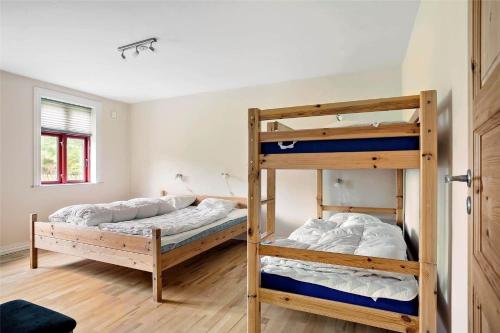 two bunk beds in a room with a window at LF13030-Karby-Agerovej-44 in Karby