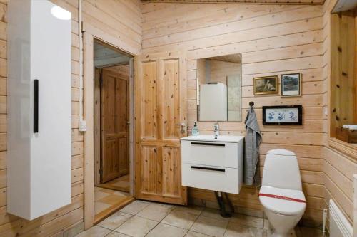 a bathroom with a white sink and a toilet at LF10999-Thyholm-Ringvejen-9 in Thyholm